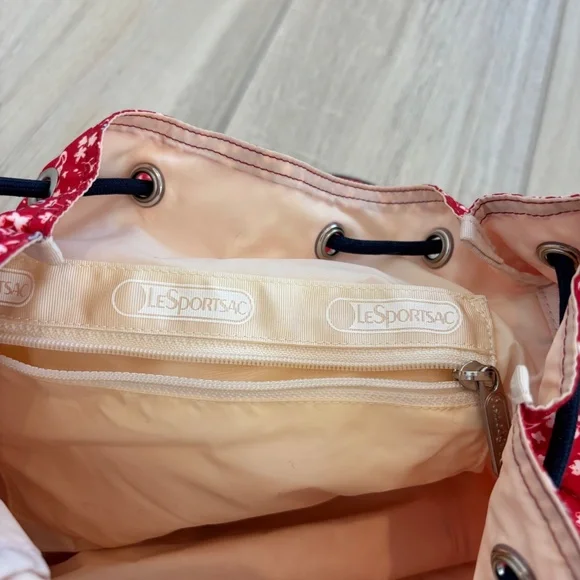 LeSportsac Small Edie Backpack in red  with a white and blue floral pattern. - Picture 9 of 12